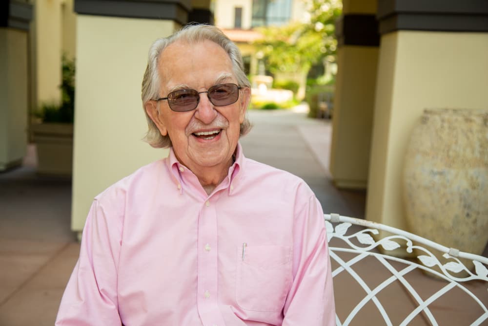 Resident enjoying the courtyard at Merrill Gardens at Rancho Cucamonga