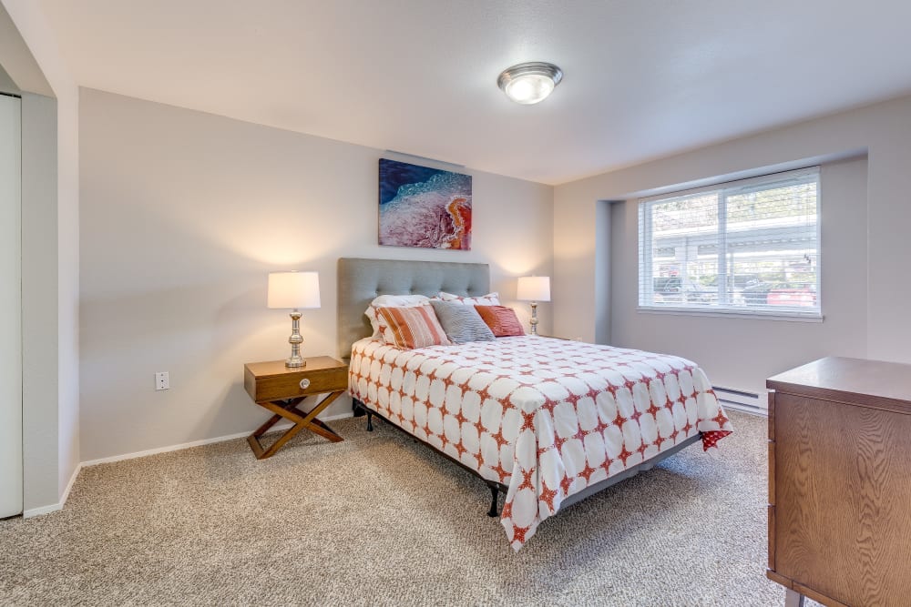 Master bedroom with a large window for natural lighting at Cascade Ridge in Silverdale, Washington