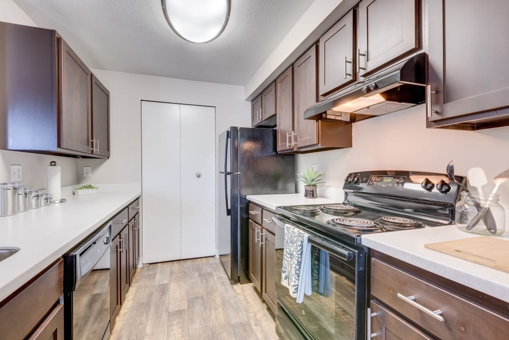 Kitchen with wood-style flooring at Cascade Ridge in Silverdale, Washington