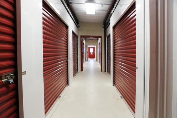 Interior units with red doors at StoreSmart Self-Storage in Englewood, Florida