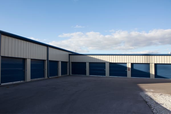 Storage units with blue doors at Midgard Self Storage in Naples, Florida