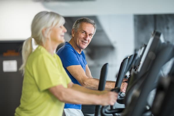 Residents in the fitness center at Villa Grande on Saxon in Orange City, Florida