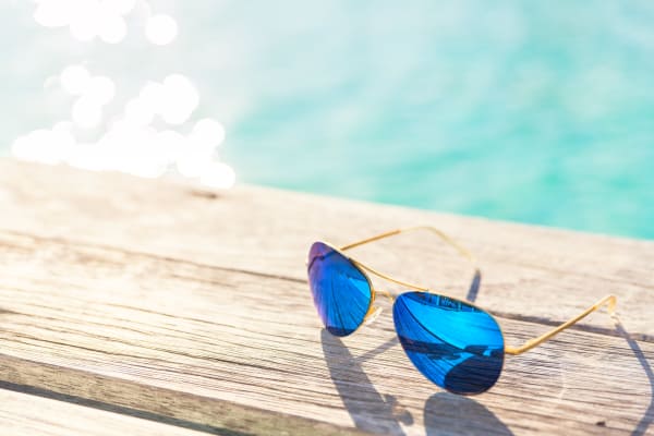 Sunglasses next to the swimming pool at Springs at Castle Rock in Castle Rock, Colorado