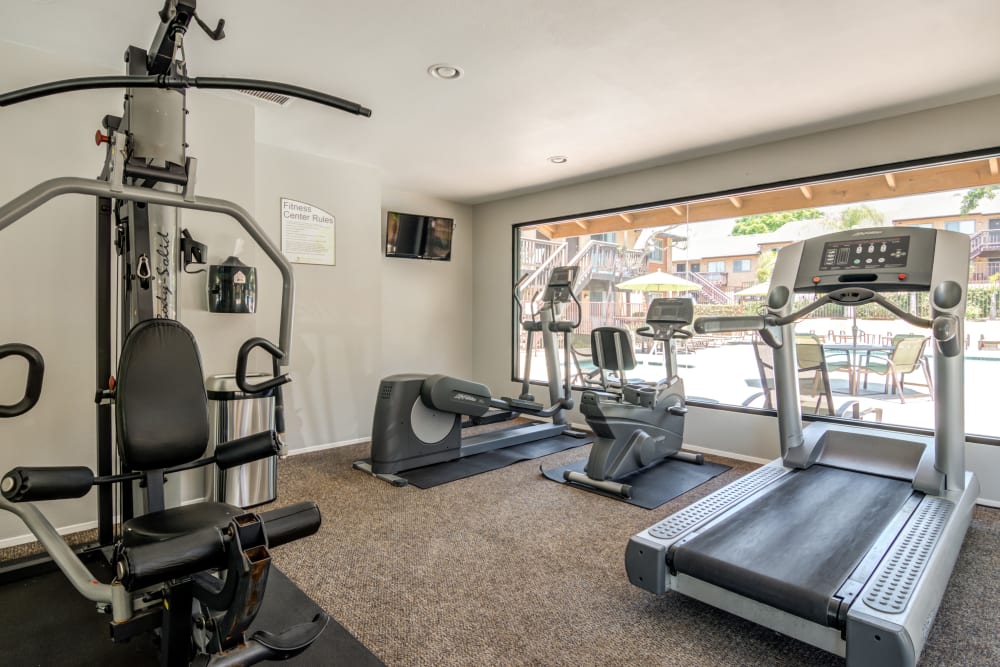 Fitness center with plenty of individual workout stations at Hillside Terrace Apartments in Lemon Grove, California
