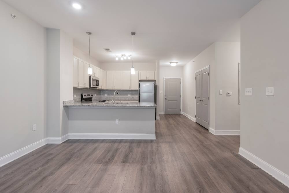 Modern apartment with wood style flooring at Charthouse at James Island in Charleston, South Carolina