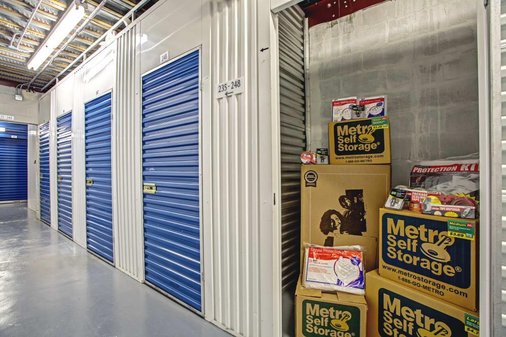 Open indoor unit with packages at Metro Self Storage in Tampa, Florida