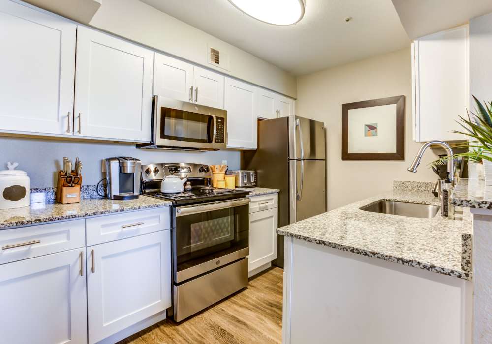 Kitchen with appliances at Cabrillo Apartments in Scottsdale, Arizona