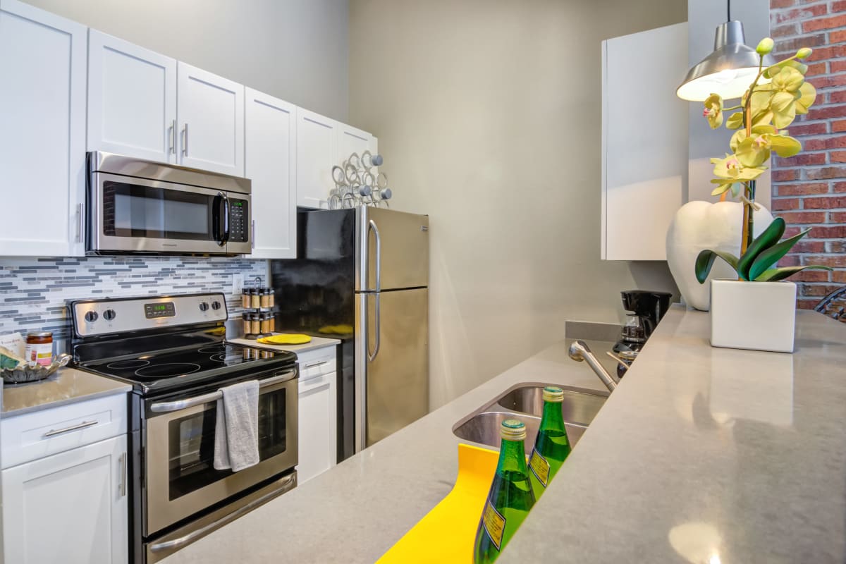 Stainless-steel appliances in an apartment kitchen at Biltmore at Midtown in Atlanta, Georgia