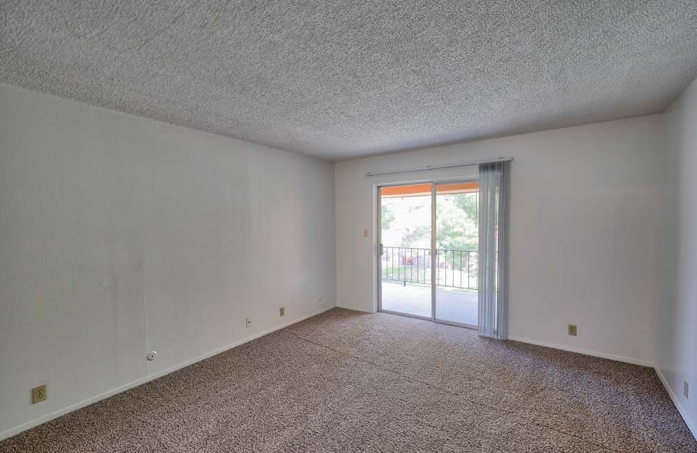 Living area with access to balcony at Camino Real in El Paso. TX