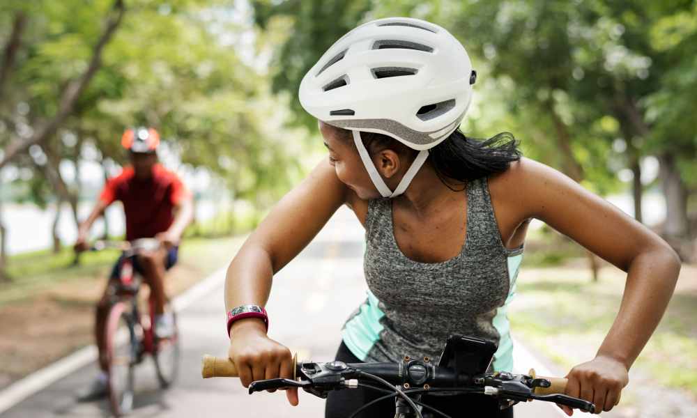 Resident biking near Valley Park Apartments in West Valley City, Utah