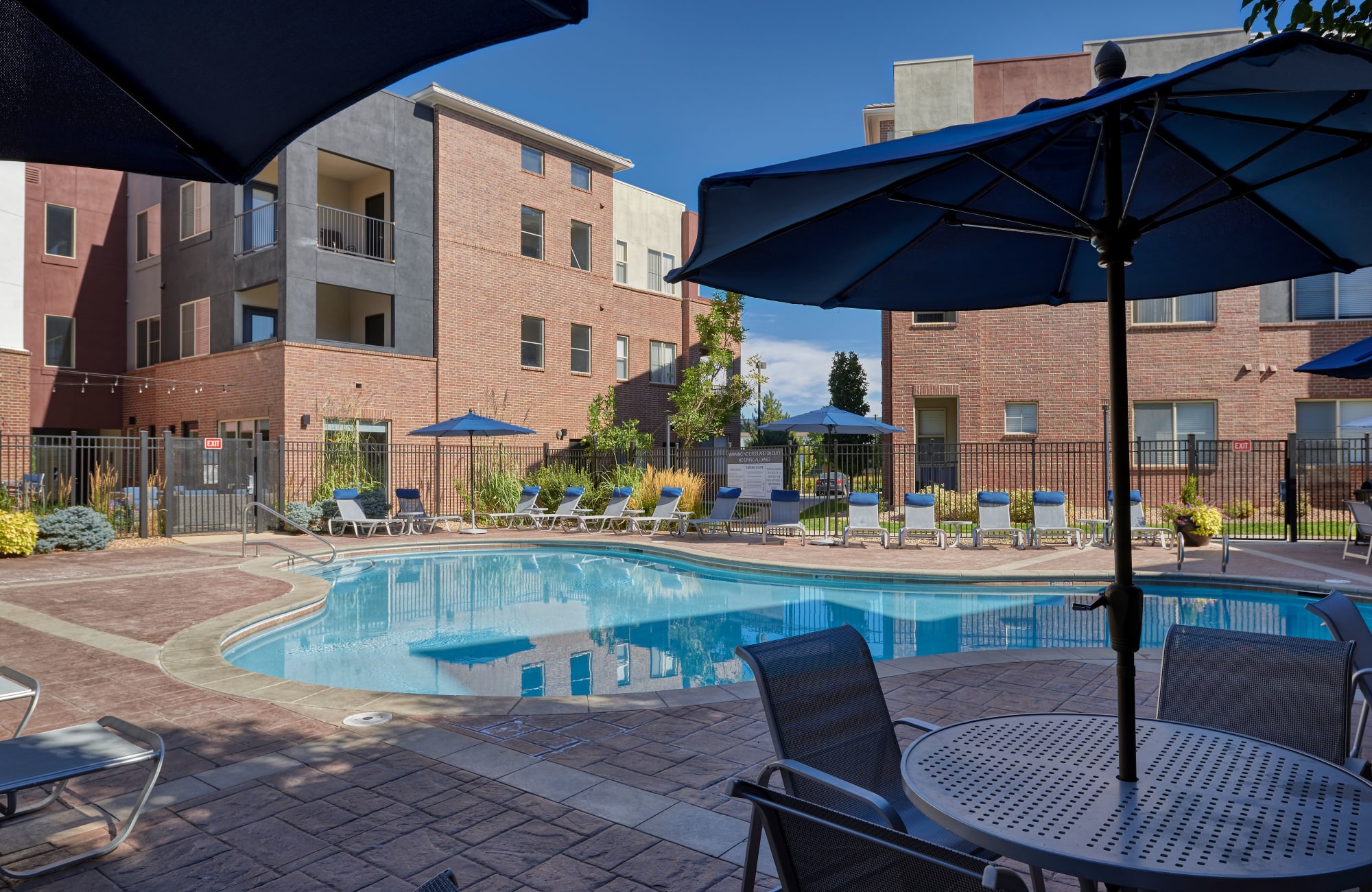 Spa and Pool with lounges and umbrellas in Englewood, CO