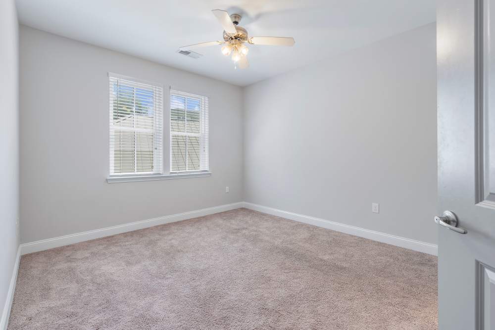 Bedroom with a ceiling fan at Charthouse at James Island in Charleston, South Carolina