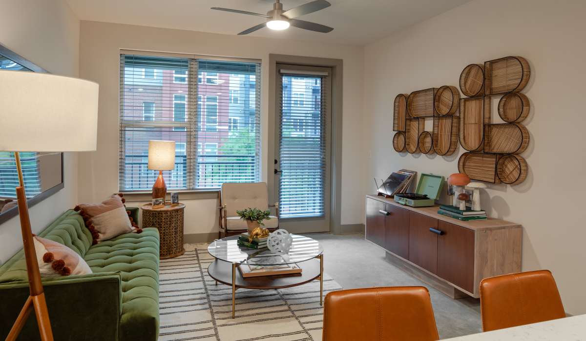 Living room with wood-style flooring at Venable Durham Apartments in Durham, North Carolina