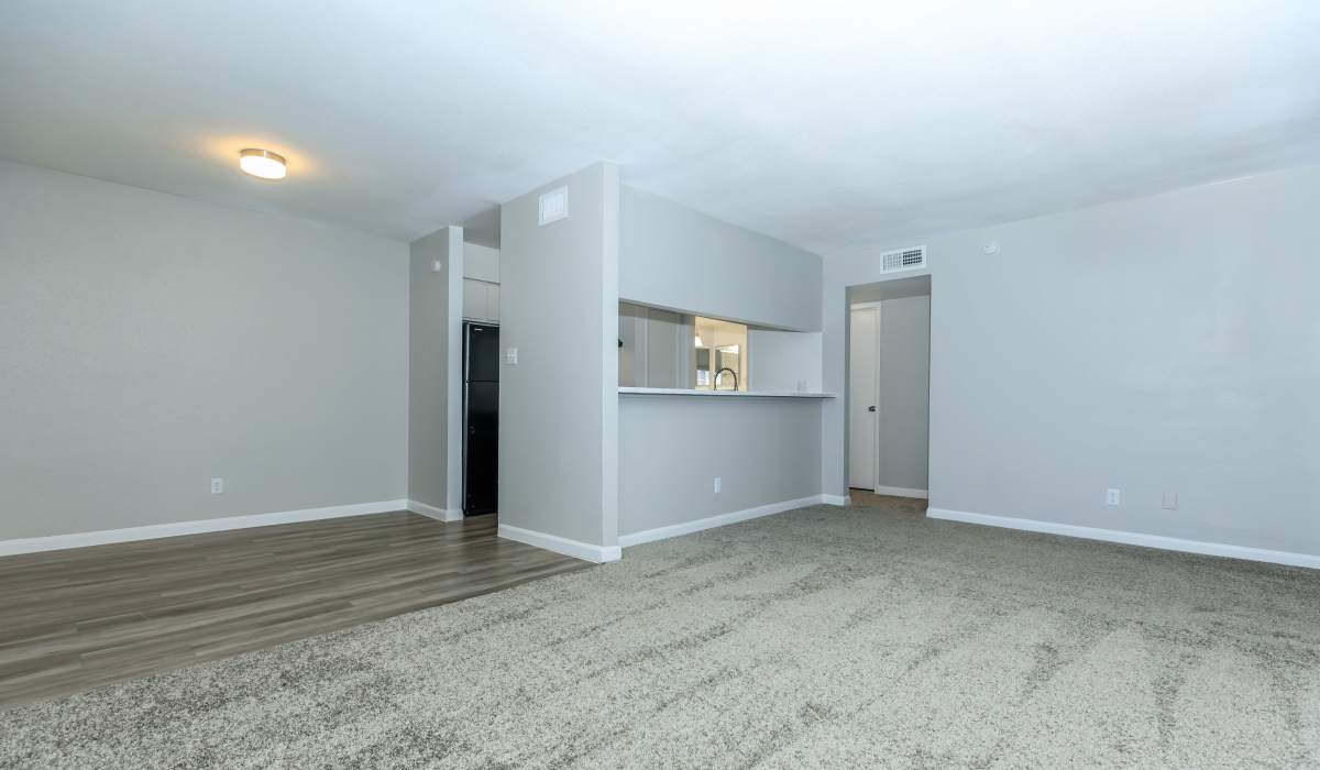 Living space with kitchen at Costa Mesa Apartments in Houston, Texas
