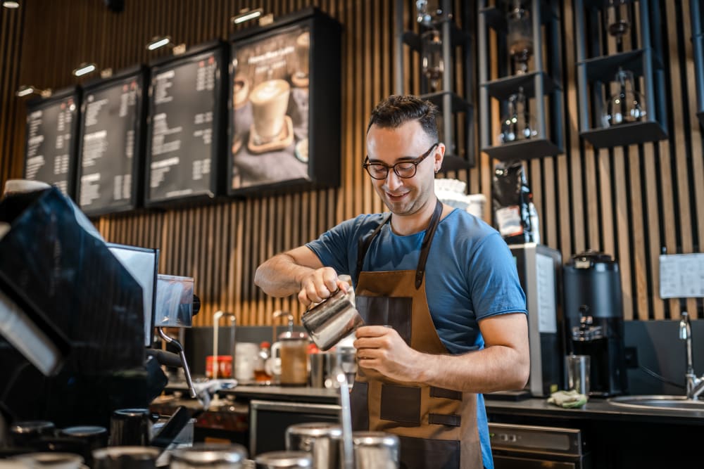 Barista pouring an expensive looking coffee near 1510 Belleville in Richmond, Virginia
