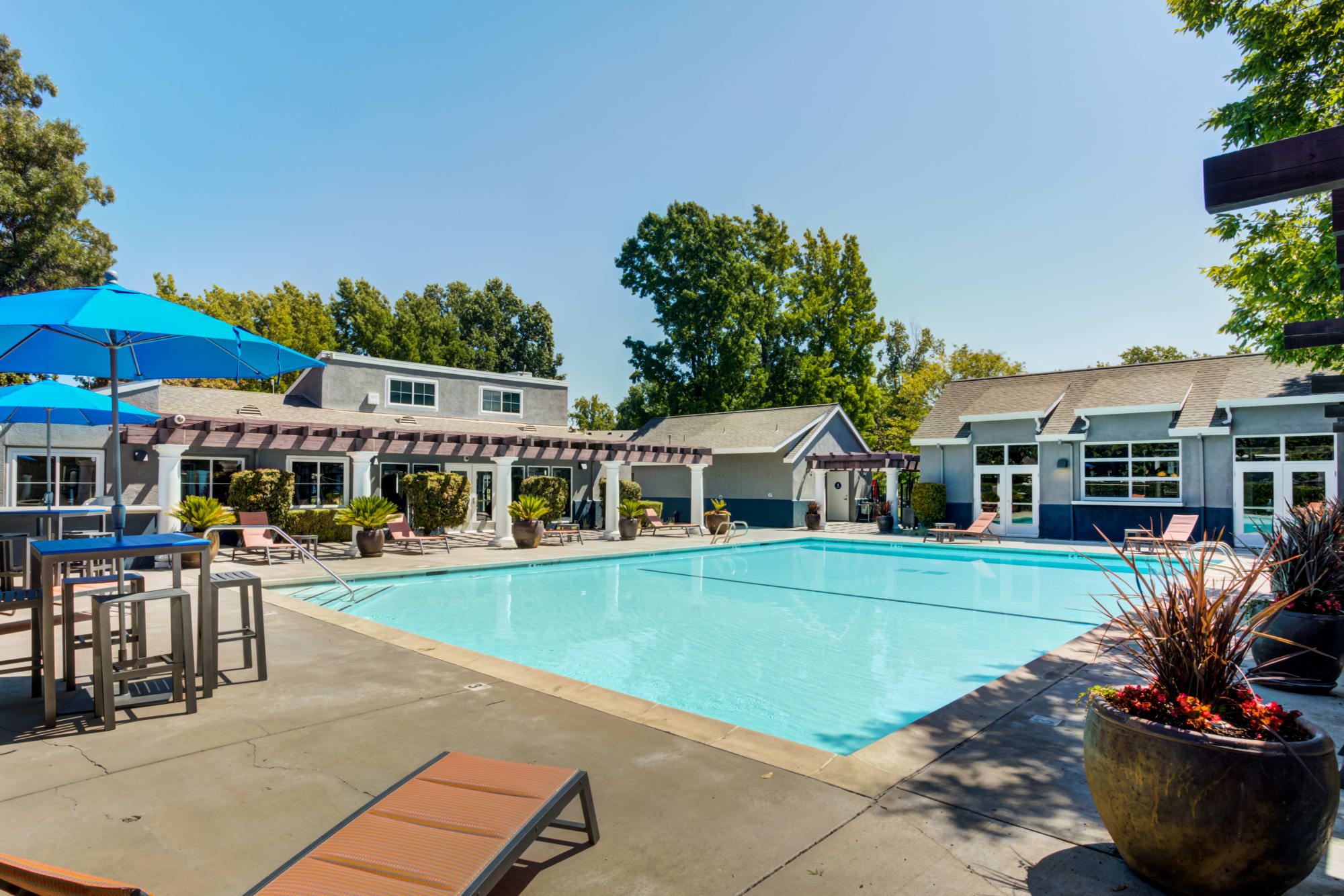 Resort style swimming pool at The Woodlands Apartments in Sacramento, California