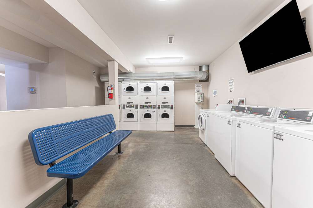 Community laundry room with washer and dryer at Tiger Village in Columbia, Missouri