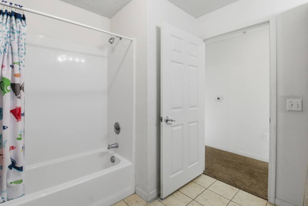 Bathroom with tub at Rose Meadows Apartments in Levelland,Texas