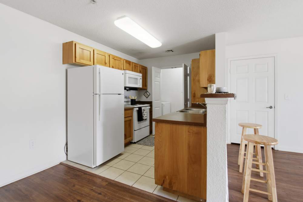 Kitchen with white appliances at Avalon Park in Brownfield, Texas
