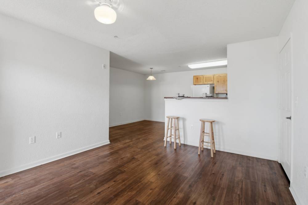 Unfurnished living room with view to kitchen at Avalon Park in Brownfield, Texas