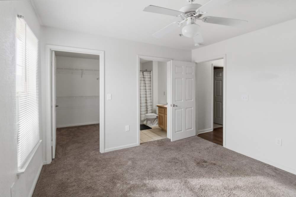 Unfurnished bedroom with walk-in closet at Avalon Park in Brownfield, Texas