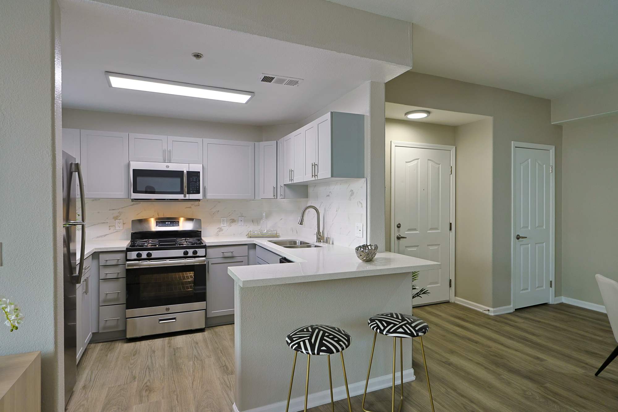 Kitchen with island and counter stools at Allure at Camarillo in Camarillo, California
