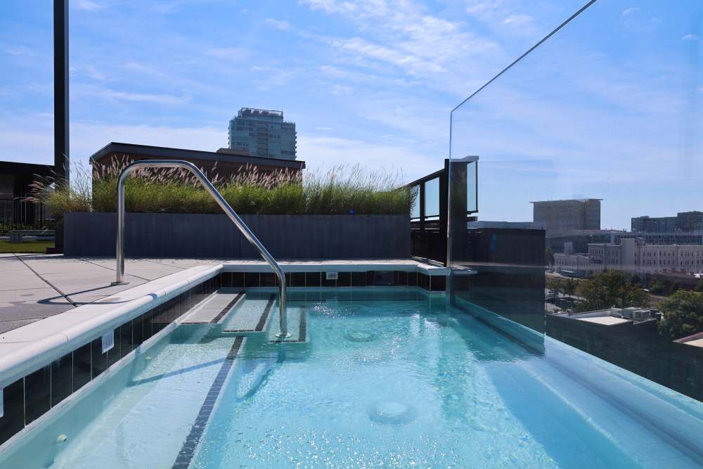Resort-style swimming pool overlooking the city at The Novus Apartments in Durham, North Carolina
