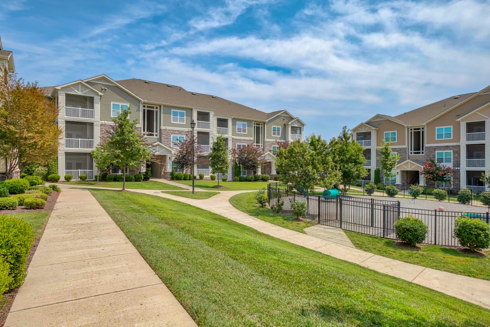 Walking Path and Fenced in dog park at Oasis at Montclair Apartments in Dumfries, Virginia