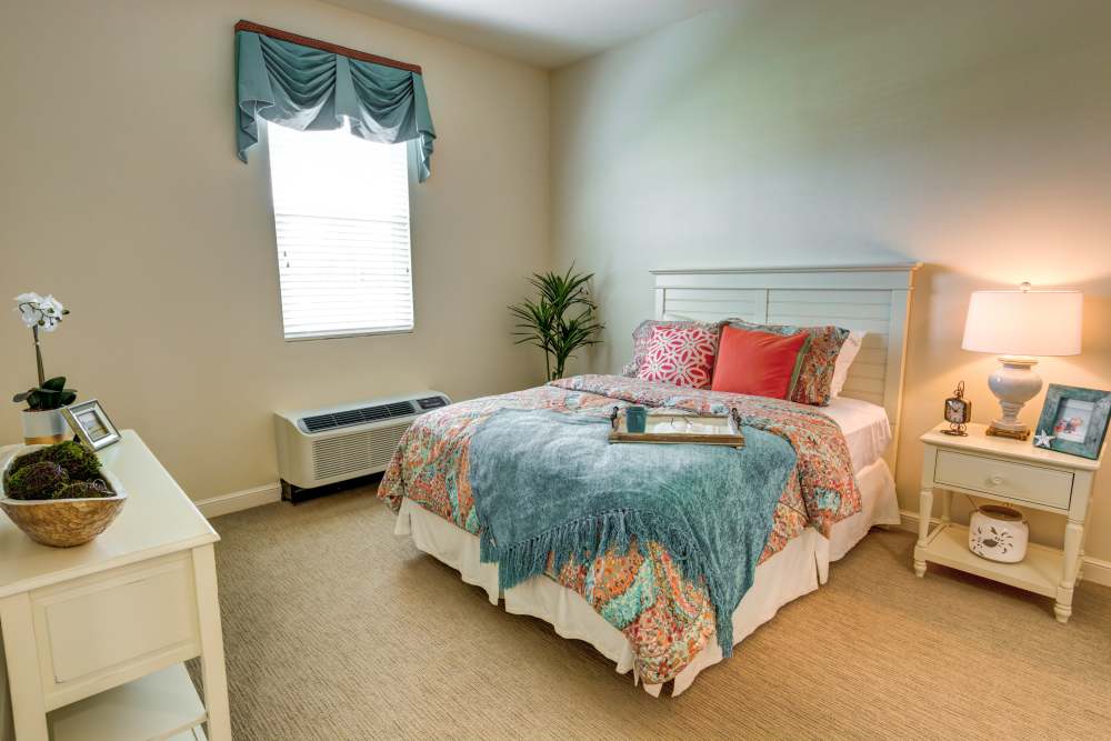 Cozy bedroom with natural light and decor at Barclay House of Stuart in Stuart, Florida