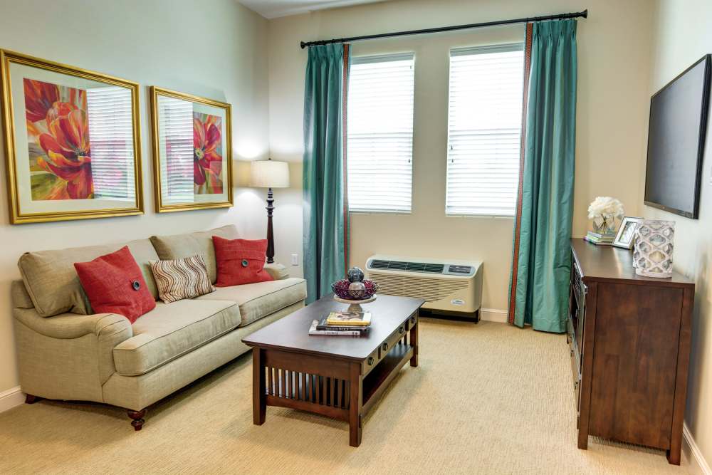Cozy living room with natural light and decor at Barclay House of Stuart in Stuart, Florida
