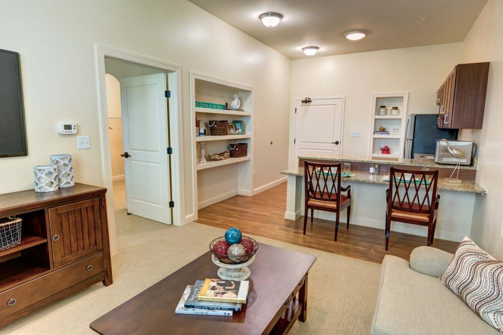 Open layout with granite countertops and wood-style flooring at Barclay House of Stuart in Stuart, Florida
