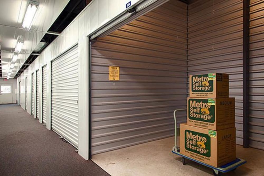 Open indoor unit with packages at Metro Self Storage in Kingwood, Texas