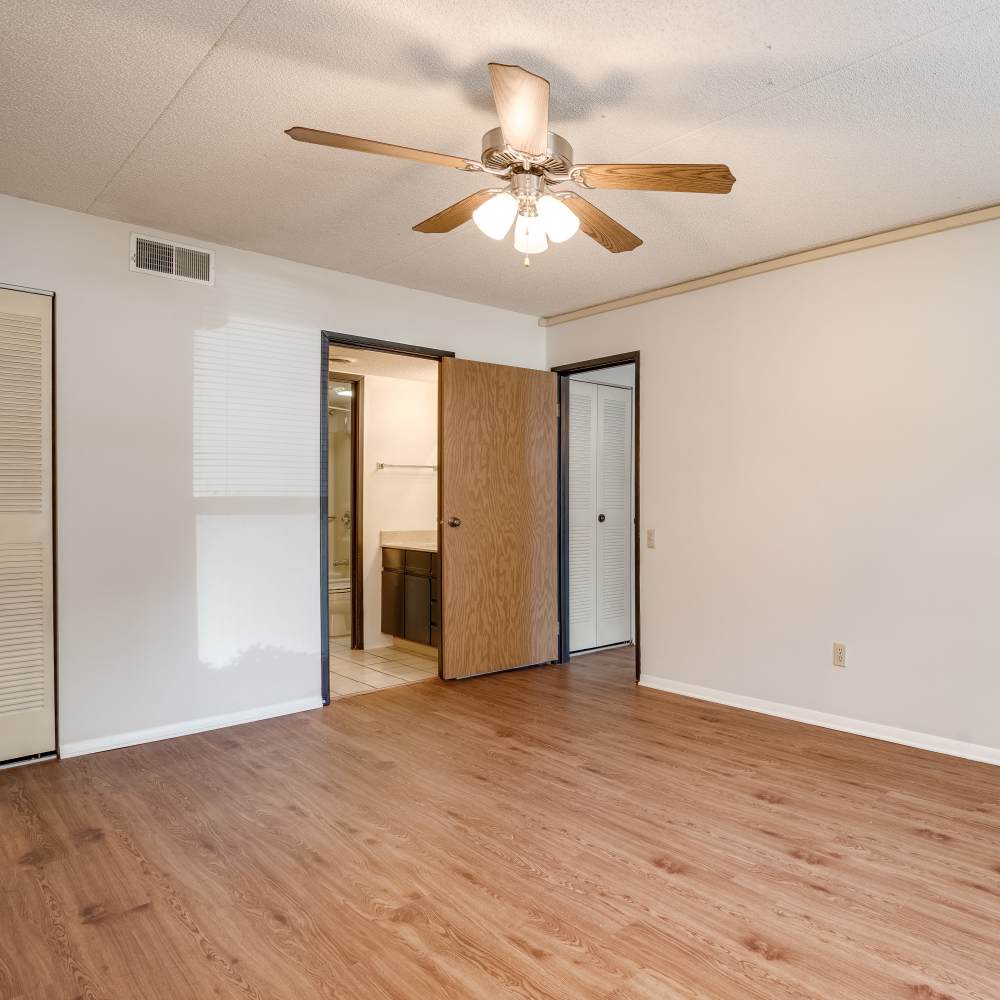 Unfurnished bedroom with ceiling fan at Germantown Gardens in East Ridge, Tennessee