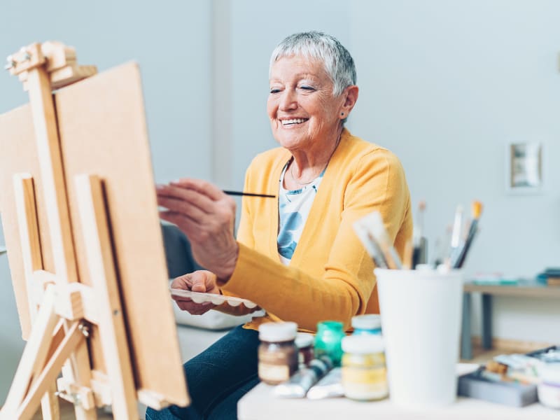 Resident painting at English Meadows Lexington Campus in Lexington, South Carolina