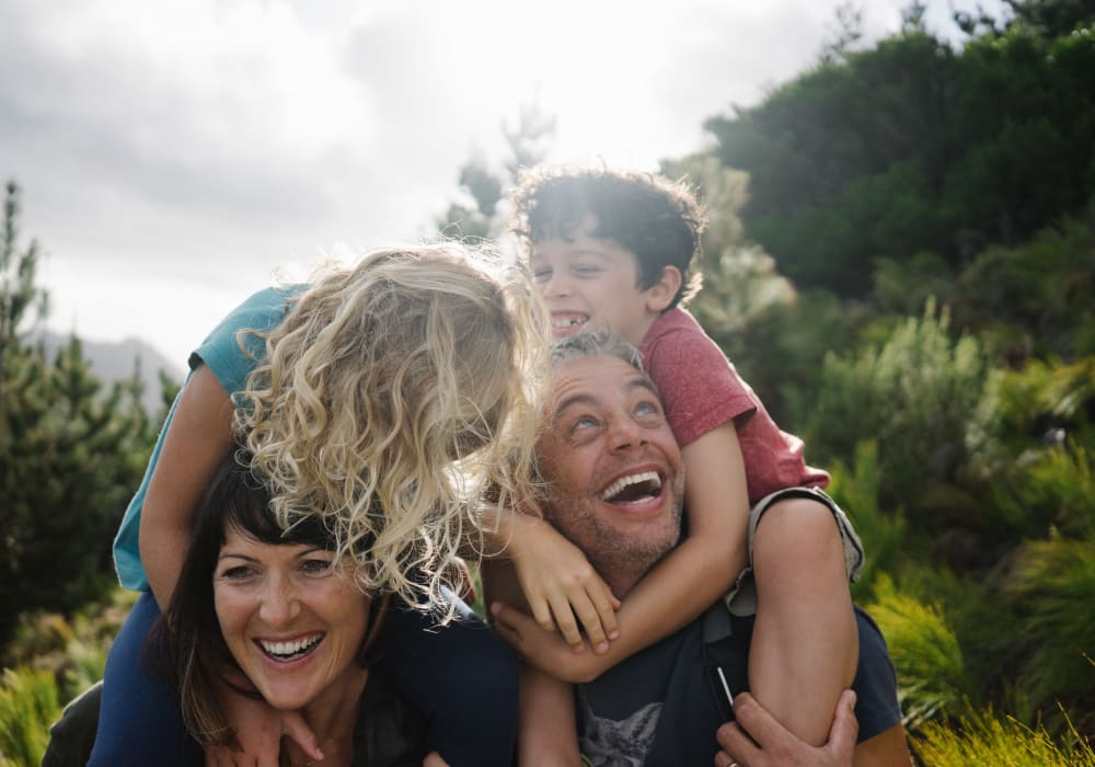 Resident family enjoying the day outside their new home at Sofi Canyon Hills in San Diego, California