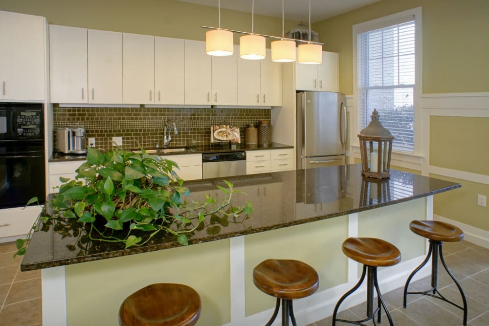 Seating at the kitchen island in the clubhouse at Cottage Trails at Culpepper Landing in Chesapeake, Virginia