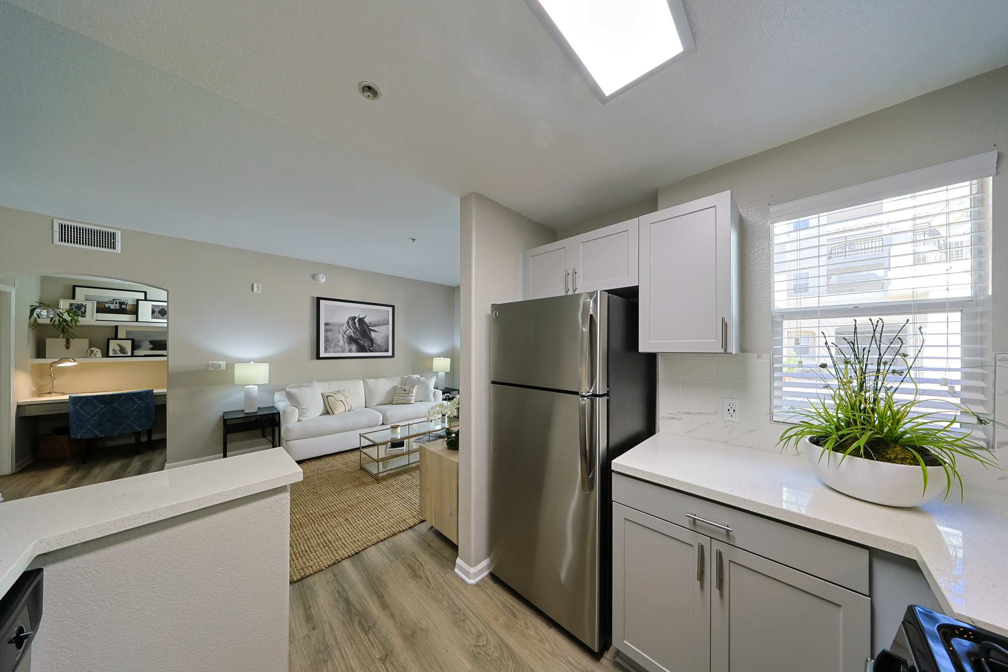 Spacious kitchen with hardwood flooring in a home at Allure at Camarillo in Camarillo, California