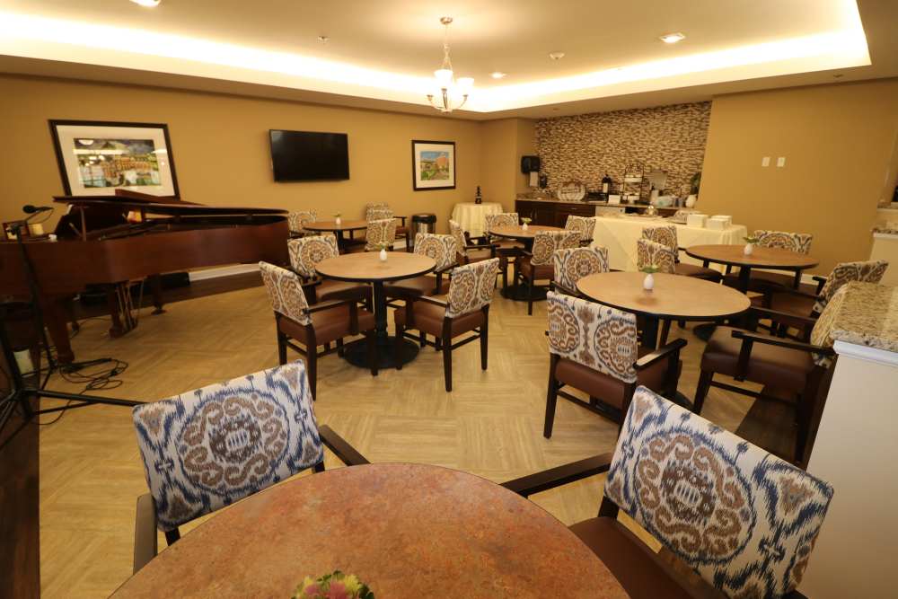 Waiting room with piano at The Harmony Collection at Roanoke - Assisted Living in Roanoke, Virginia