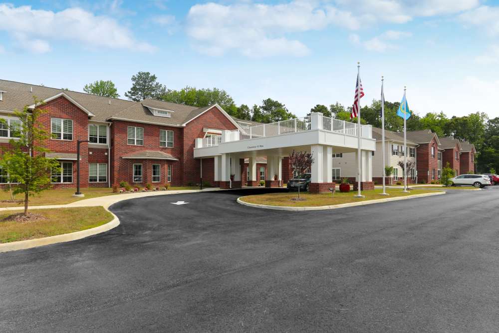 Exterior view of apartments with grass at Harmony on the Peninsula in Yorktown, Virginia