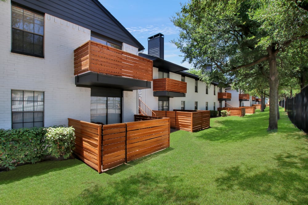 View of the two story apartments at Lockhart Apartment Homes in Mesquite, Texas