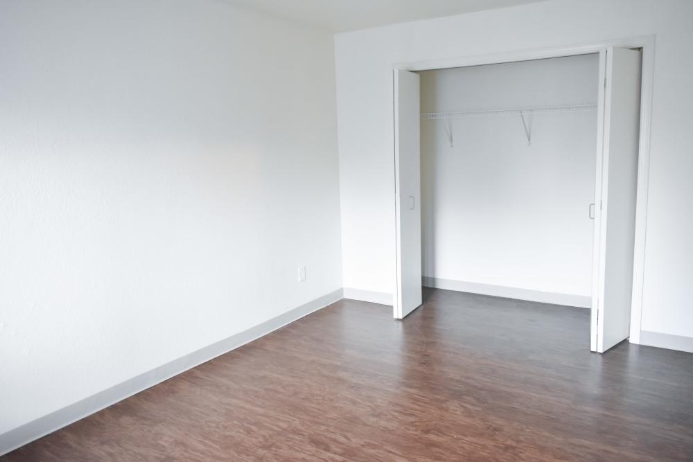 Bedroom with closets of an apartment at Clairewood Apartments in Saint Clair, Michigan