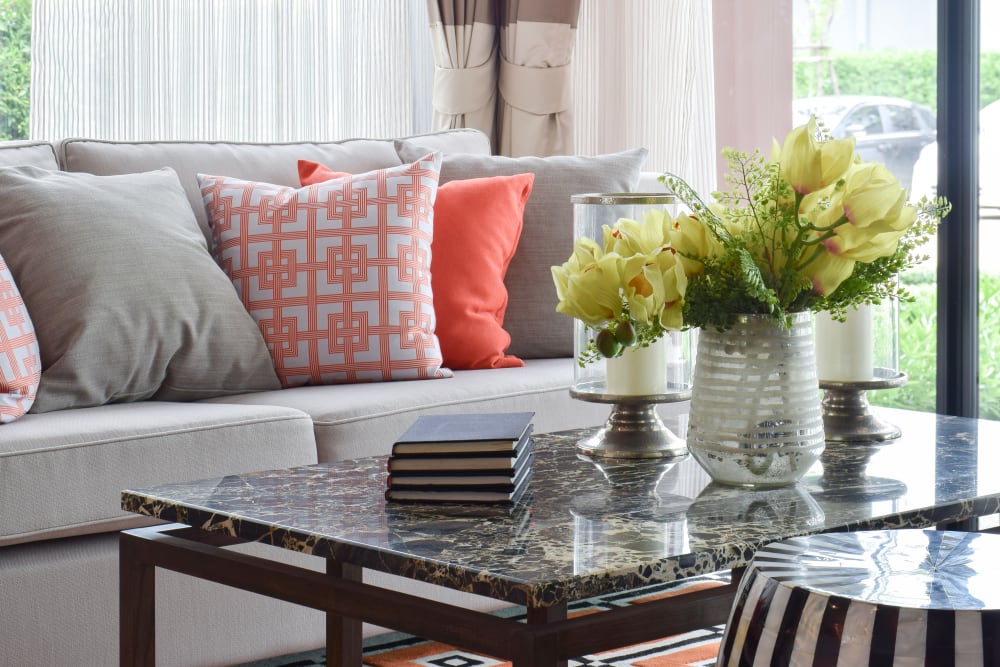A decorated apartment living room at Carnegie Heights at Henderson in Henderson, Nevada