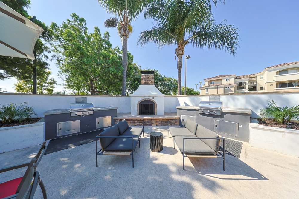 Outdoor fire-pit and grilling station at Allure at Camarillo in Camarillo, California