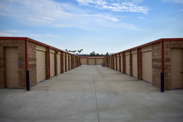 Looking down a row of exterior storage units at STOR-N-LOCK Self Storage in Redlands, California