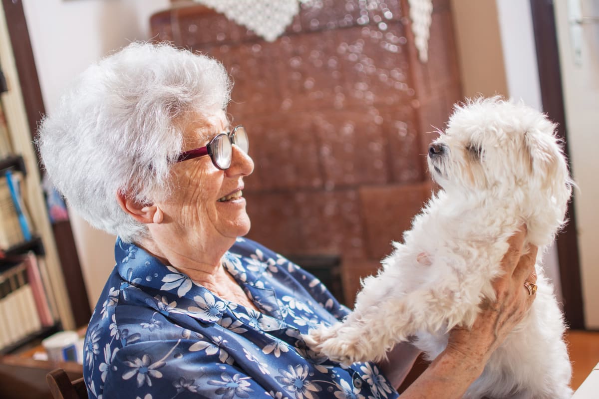 Resident and her dog at CHAI Apartment Communities in Baltimore, Maryland