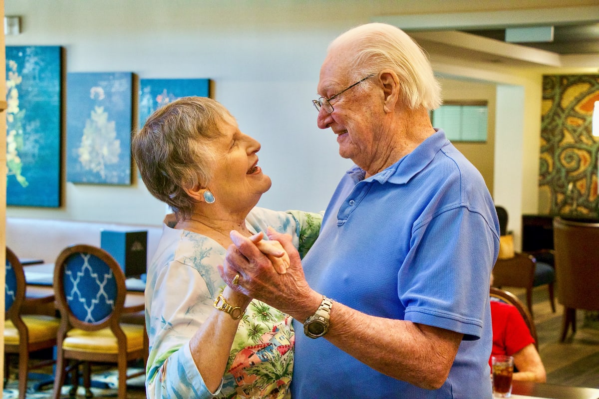 Couple dancing at an Integrated Senior Lifestyles community