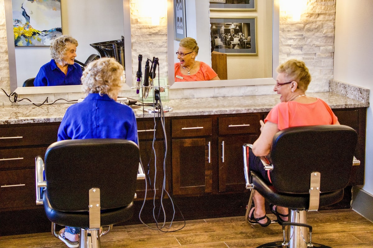 Two ladies getting their hair done at Raider Ranch in Lubbock, Texas