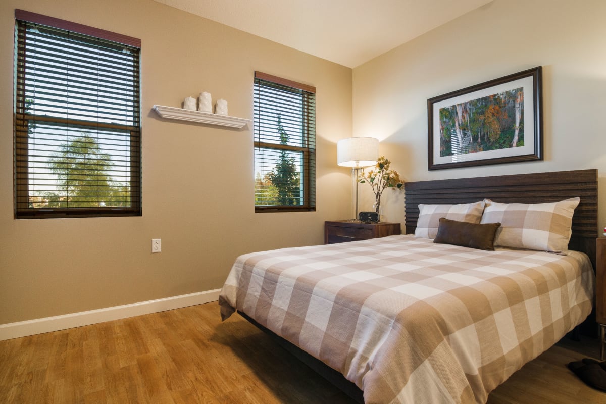 Resident bedroom with natural light at CERTUS Premier Memory Care Living in Vero Beach, Florida.