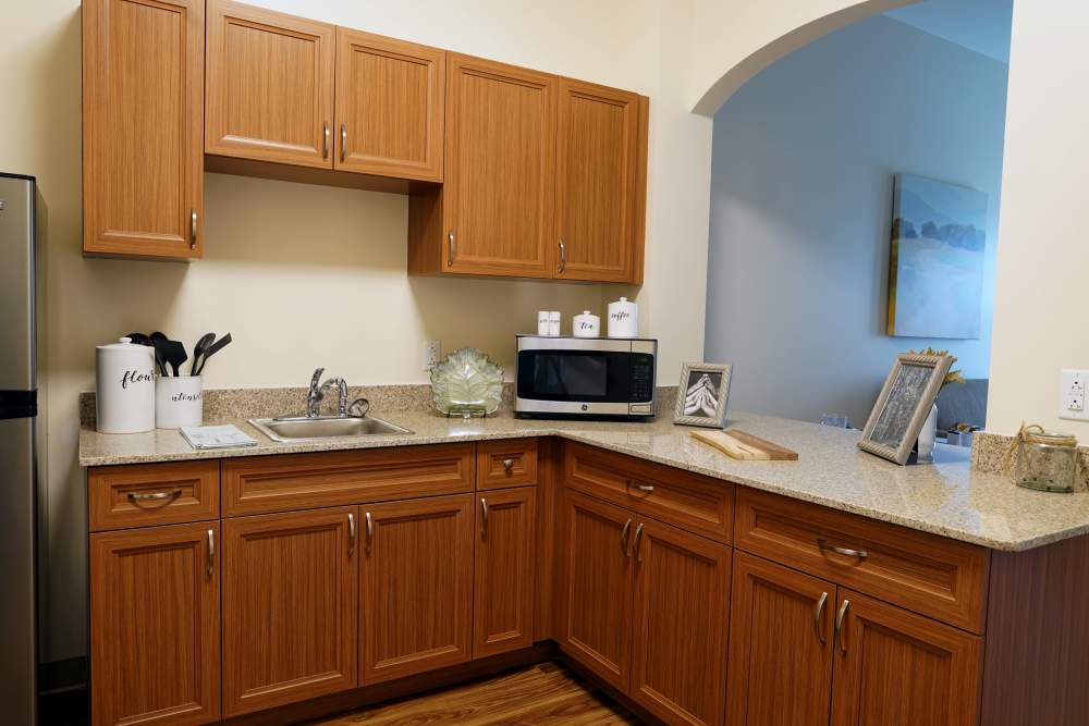 Modern kitchen with wood cabinet at Harmony at Morgantown in Morgantown, West Virginia