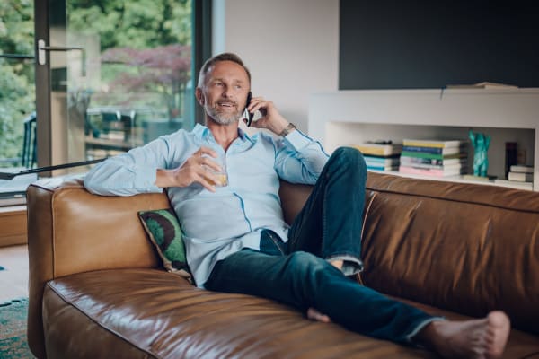 Resident relaxing in his new apartment at The George in Indianapolis, Indiana